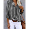 Light blue and white striped Lumina Wear Mia summer blouse with a relaxed fit and airy fabric, perfect for warm weather.