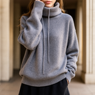 Relaxed oversized Lumina Wear Milan merino wool hoodie with breathable fabric and adjustable neck in a casual style.