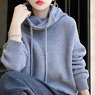 Lumina Wear Milan oversized breathable merino wool hoodie with adjustable neck, relaxed fit, and cozy texture.