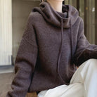 Lumina Wear Milan relaxed oversized hoodie made of breathable merino wool with adjustable neck detail.