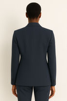 Natalie white tailored pantsuit with straight leg design from Lumina Wear, shown on a mannequin. Classic and elegant formal suit.