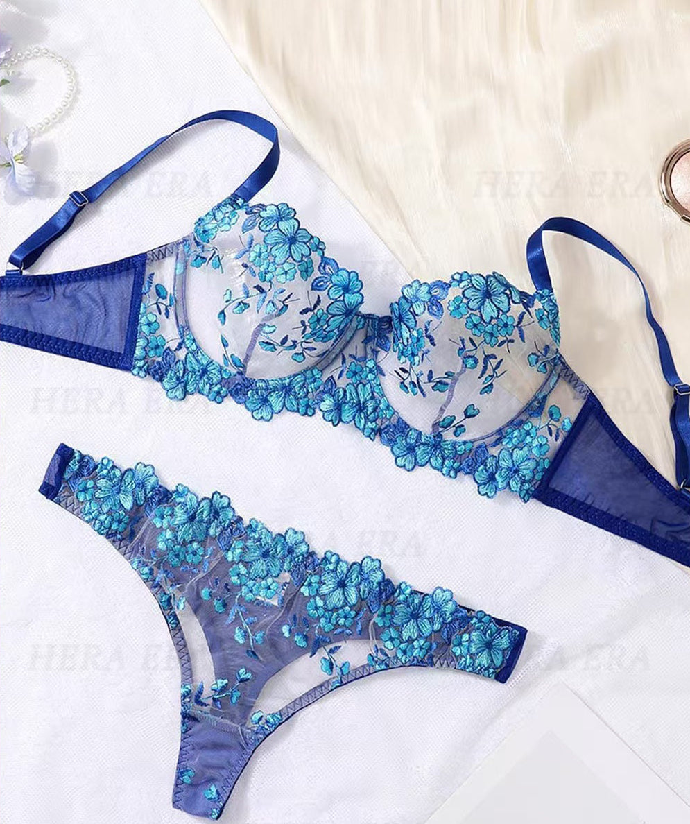 Blue floral embroidery lingerie set by Lumina Wear, featuring delicate lace and intricate floral details.