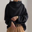 Rachel high-neck long sleeve top by Lumina Wear, elegant black top with fitted design and ribbed texture.