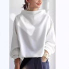 Rachel Lumina women's high-neck top with long sleeves, featuring a sleek, elegant design and soft fabric.