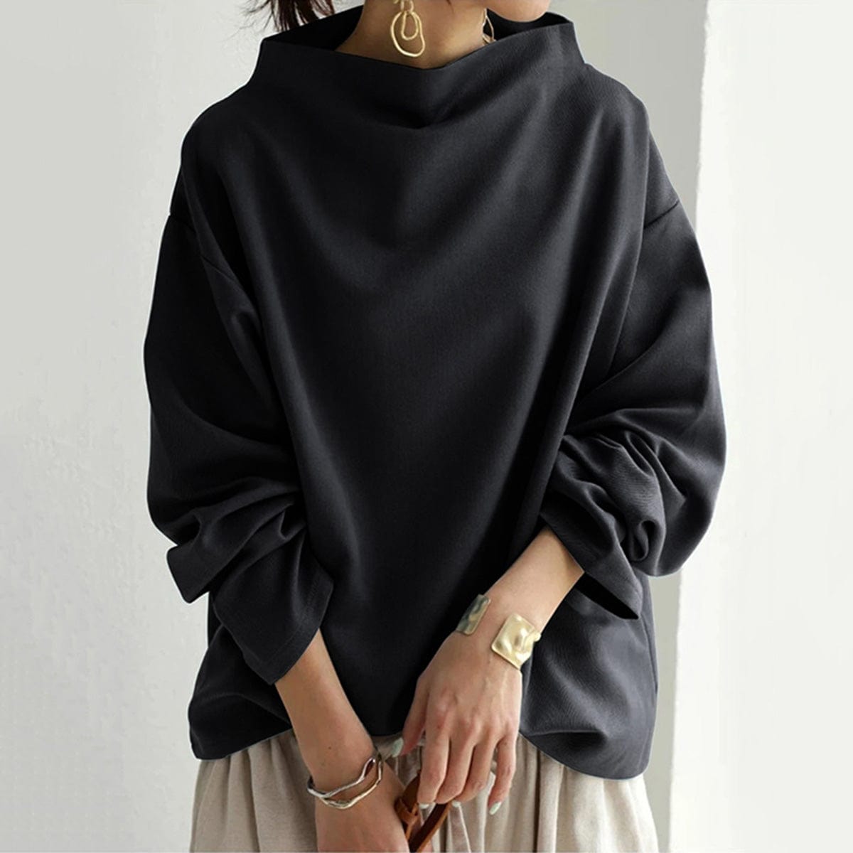 Rachel Lumina Wear elegant high-neck long sleeve women's top featuring a fitted silhouette and soft fabric in a neutral color.