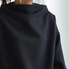 Elegant high-neck women's top by Lumina Wear featuring long sleeves, styled with a sleek fit and sophisticated design.