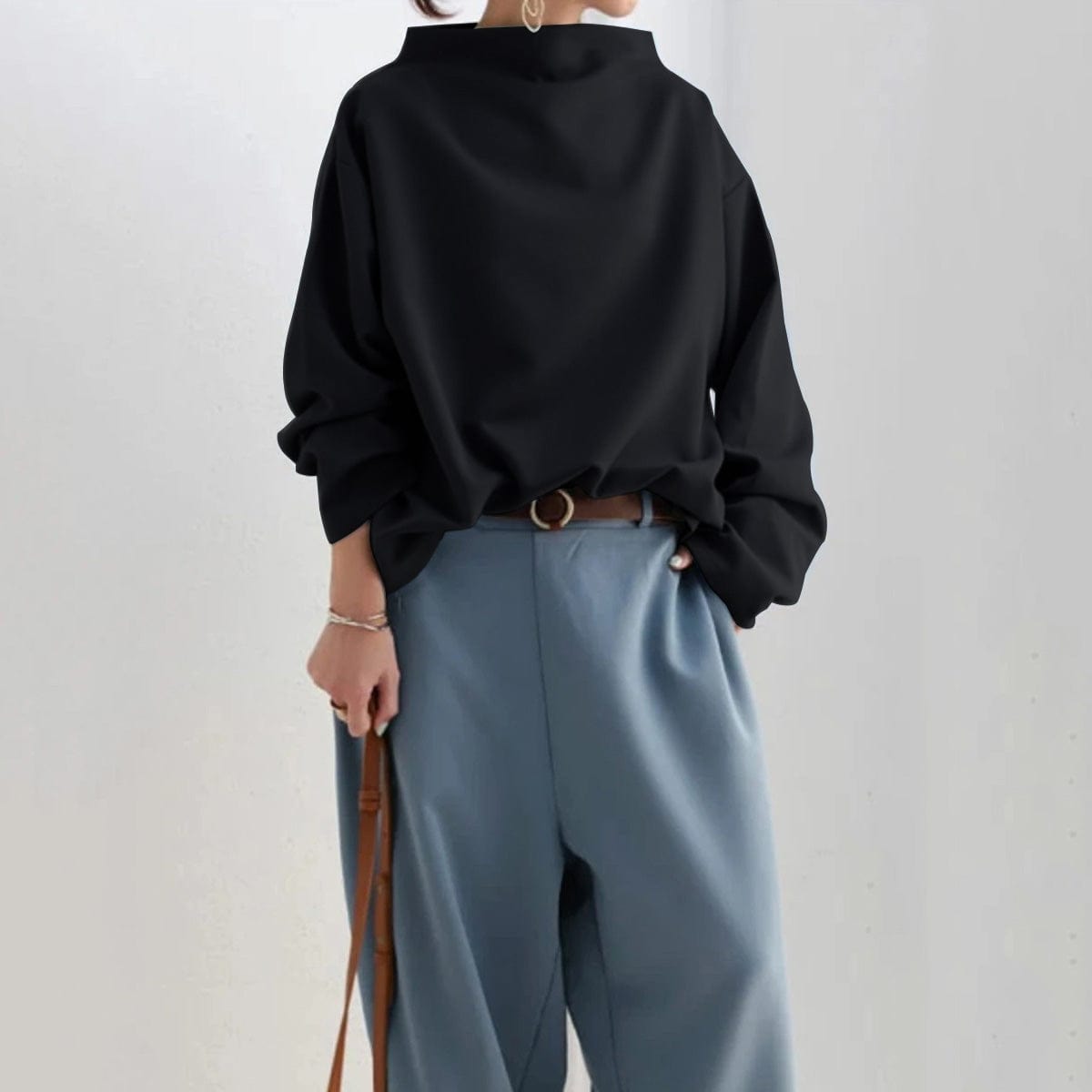 Elegant Lumina Wear Rachel high-neck women's top with long sleeves, showcasing a fitted silhouette and soft fabric.