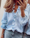Serena Lumina Wear elegant ruffle detail blouse with V-neck, showcasing feminine design and lightweight fabric.