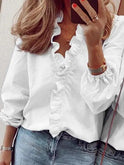 Lumina Wear Serena elegant ruffle detail blouse with V neck, showcasing a stylish, flowy fabric and feminine design.