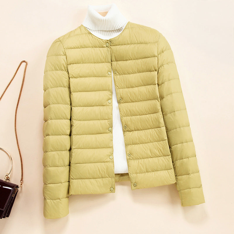 Lightweight quilted puffer jacket with snap button closure from Lumina Wear's Serena down jacket collection.