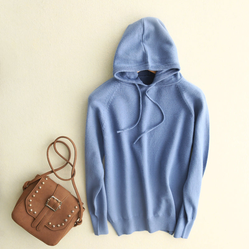 Lumina Wear Serena lightweight soft knit hoodie with relaxed fit and adjustable drawstrings, shown in a casual outdoor setting.