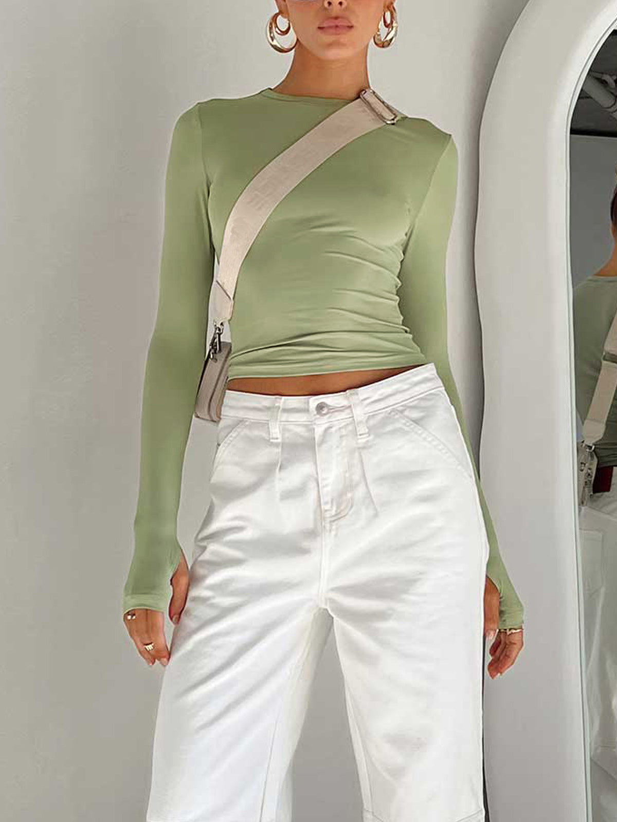 Lumina Wear Serena sleek modern crop top with versatile styling, shown in a close-up image highlighting its fitted design and fabric texture.
