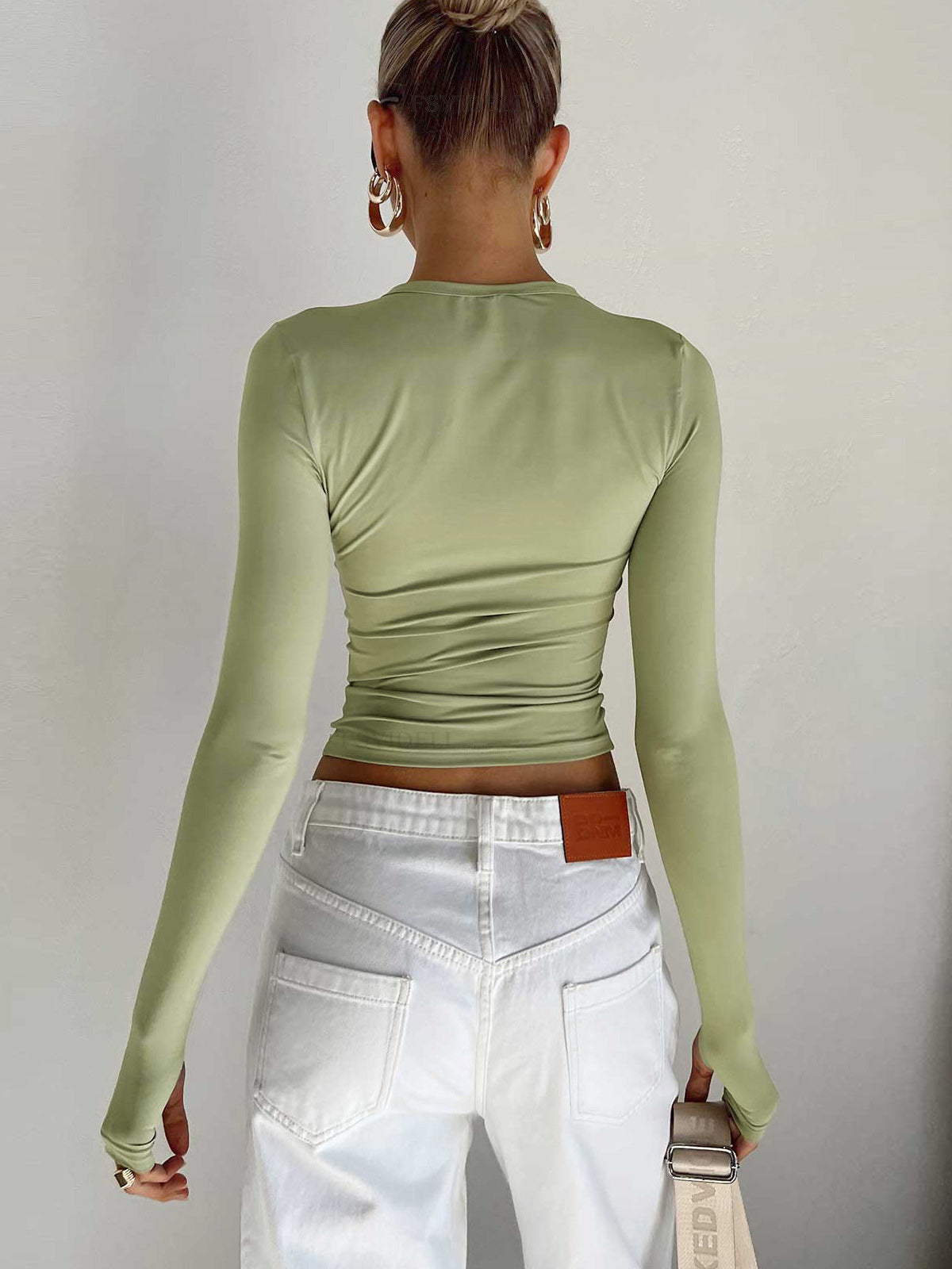 Lumina Wear Serena sleek modern crop top with versatile styling, shown in a close-up of the stylish, fitted design.