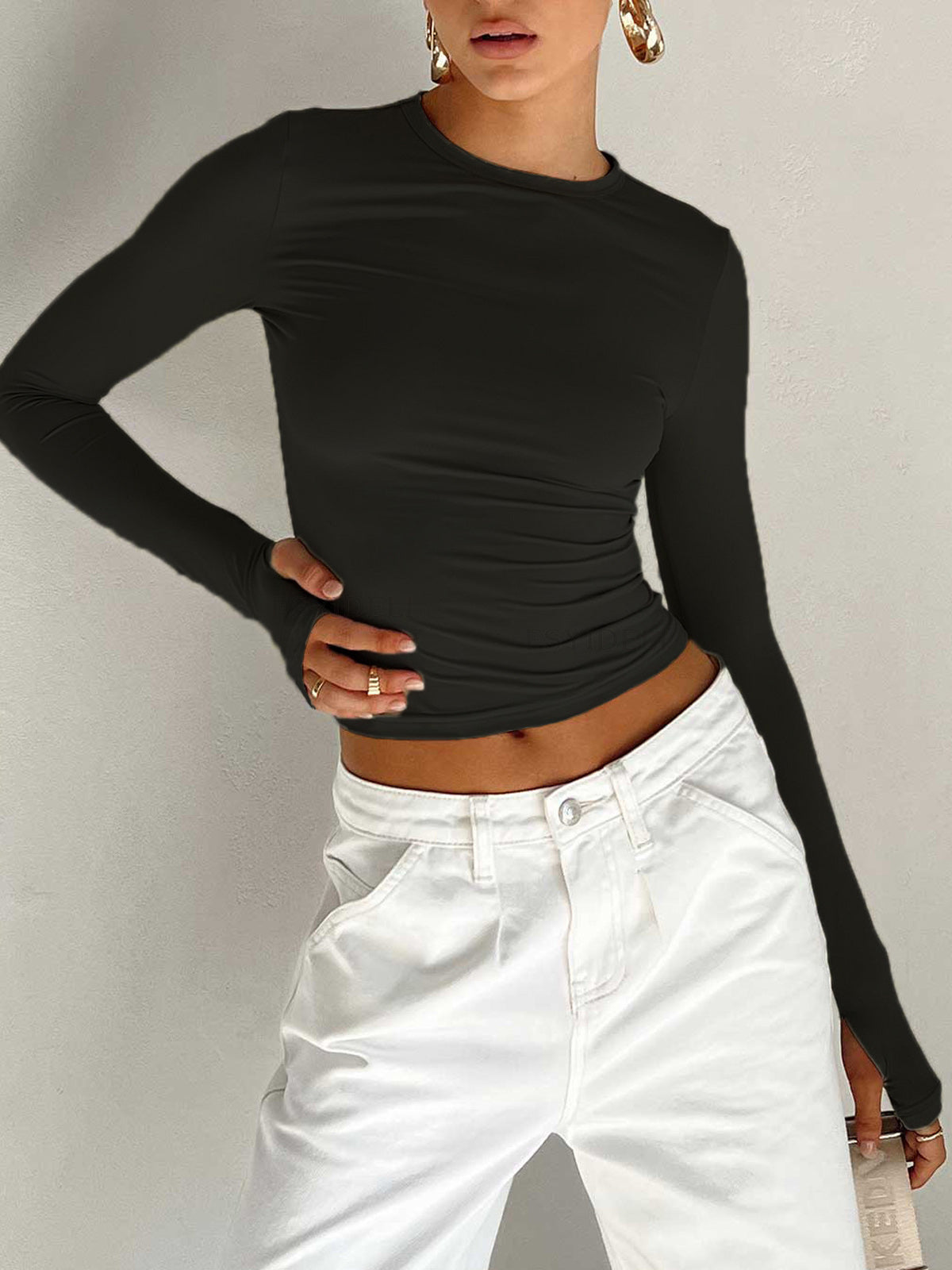Lumina Wear Serena sleek modern crop top with versatile styling, shown in a stylish outfit on a model.