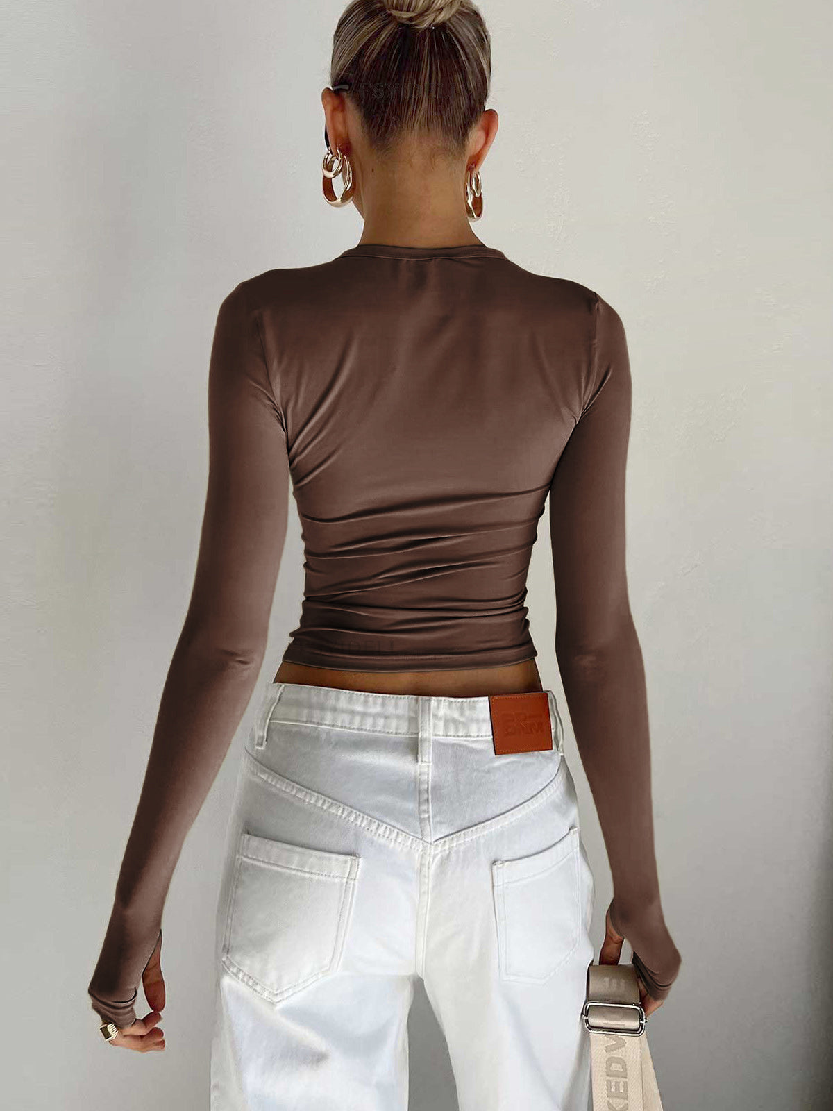 Lumina Wear Serena modern crop top with sleek design and versatile styling, shown on a model with neutral background.