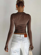 Lumina Wear Serena modern crop top with sleek design and versatile styling, shown on a model with neutral background.