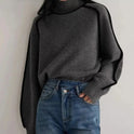 Lumina Wear Sloane minimalist high neck ribbed sweater with elegant piping, shown in a neutral color on a mannequin.