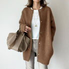 Women’s relaxed fit wool cardigan with suede accents by Lumina Wear, featuring a cozy, stylish design and neutral tones.