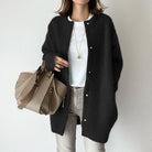 Light brown women's wool cardigan with relaxed fit and suede accents from Lumina Wear, styled with sleeves and open front.