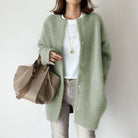Women's relaxed fit wool cardigan with suede accents by Lumina Wear, shown in a cozy, stylish design.