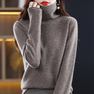 Lumina Wear Sofia cozy loose-fit sweater with stacked collar, shown in a relaxed fit on a woman, in a soft knit fabric.