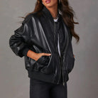 Sofia edgy faux leather jacket with sleek band collar from Lumina Wear, featuring a stylish, fitted design and smooth black finish.