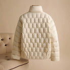 Elegant double-breasted insulated women's jacket in broadcloth from Lumina Wear, shown in a stylish, fitted design.