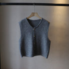 Elegant knitted women's vest by Lumina Wear, featuring a stylish layered design in soft, cozy fabric.