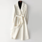 Elegant monochrome wool coat with waist belt from Lumina Wear, featuring a tailored fit and sophisticated style for women.