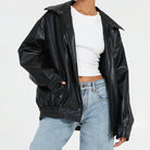 Lumina Wear Sofia oversized faux leather bomber jacket with relaxed fit, shown in a stylish close-up image.
