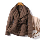 Lumina Wear Sofia quilted structured down jacket with tie belt, featuring a sleek design and warm insulation.