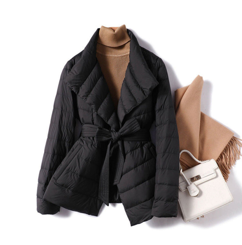 Lumina Wear Sofia quilted structured down jacket with tie belt, featuring a stylish and warm design.