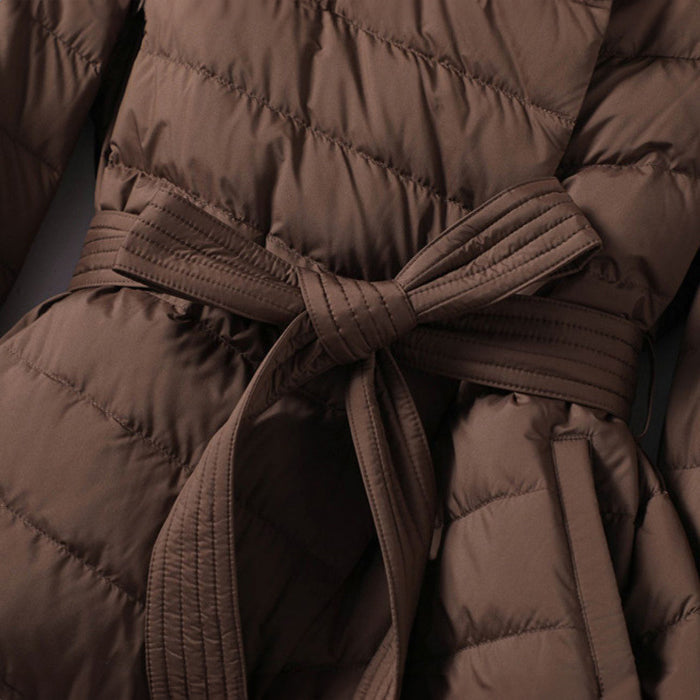 Lumina Wear Sofia quilted structured down jacket with tie belt, featuring a sleek design and warm insulation.