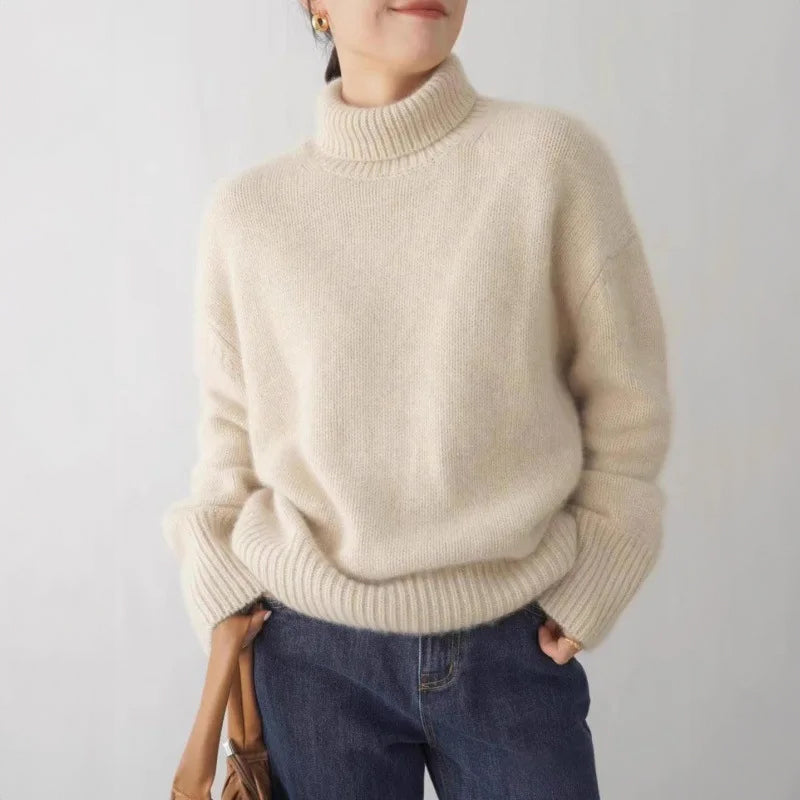 Light gray Lumina Wear Sofia relaxed ribbed turtleneck sweater with dropped shoulders, soft knit fabric, and cozy fit.