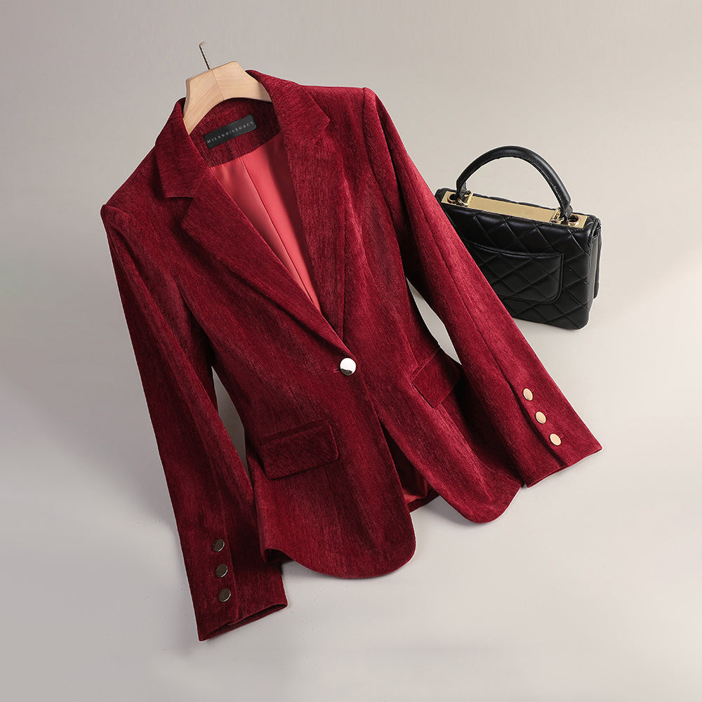 Elegant women's velvet blazer by Lumina Wear featuring a slim tailored fit and radiant texture, styled for sophisticated looks.