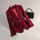 Elegant women's velvet blazer by Lumina Wear featuring a slim tailored fit and radiant texture, styled for sophisticated looks.