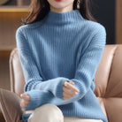 Woman wearing Lumina Wear Sofia striped oversized turtleneck sweater, casual and cozy, with bold horizontal stripes and relaxed fit.