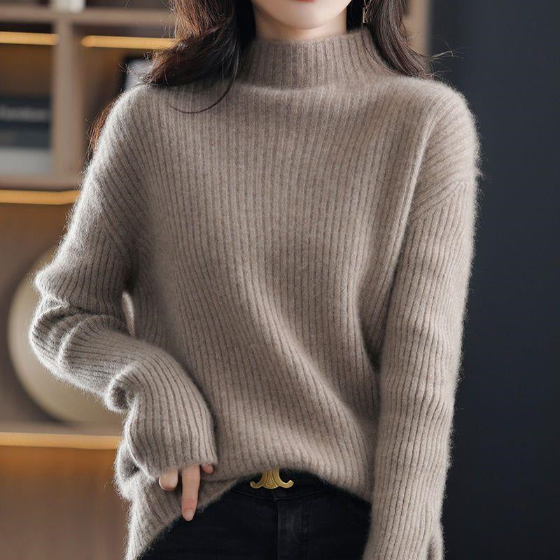 Light gray and white striped Lumina Wear Sofia oversized turtleneck sweater, casual style, cozy fit, worn on a woman.