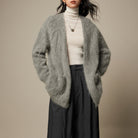 Light beige Lumina Wear Sofia ultra-soft breathable loose-fit women's cardigan sweater displayed on a hanger.