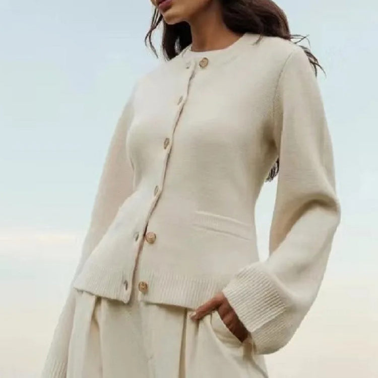 Vintage-inspired Sofia Lumina Wear button cardigan with side pockets, featuring elegant design and soft knit fabric.