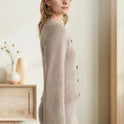 Vintage-inspired Lumina Sofia button cardigan with side pockets, featuring elegant design and soft knit fabric.