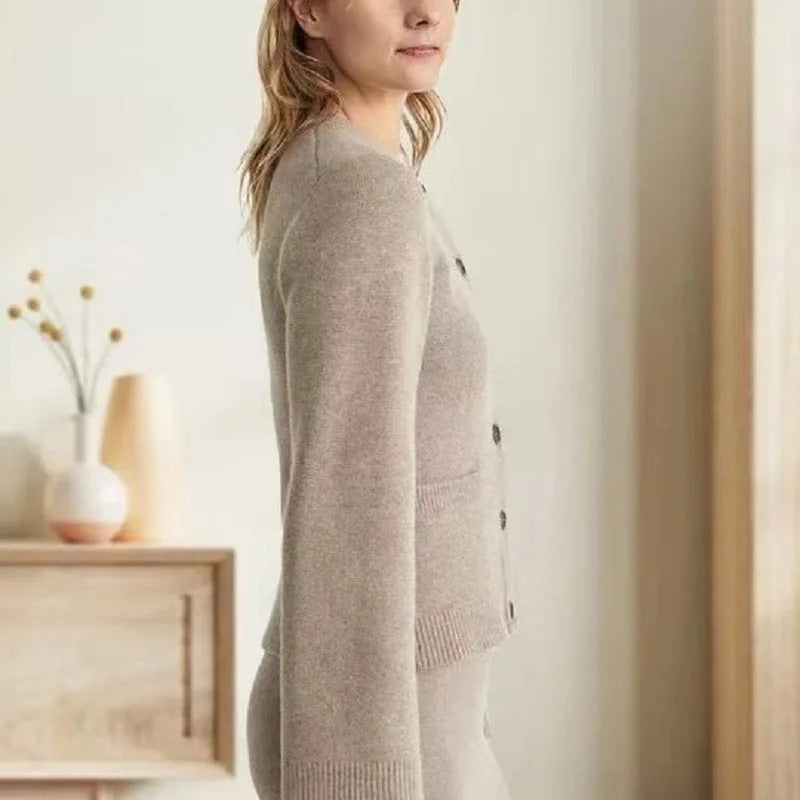 Vintage-inspired Sofia Lumina Wear button cardigan with side pockets, featuring elegant design and soft knit fabric.