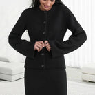 Vintage-inspired Sofia Lumina Wear button cardigan with side pockets, featuring elegant design and soft knit fabric.
