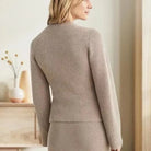 Vintage-inspired Sofia Lumina Wear button cardigan with side pockets, featuring elegant design and soft knit fabric.