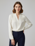 Sophia Lumina Wear elegant puff sleeve blouse with tailored waist, stylish and sophisticated for modern fashion.