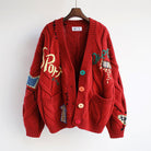 Valentina oversized knit cardigan by Lumina Wear featuring bold patchwork, colorful buttons, and a cozy, relaxed fit.