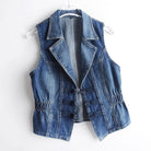 Valentina Celestial medium blue washed denim vest with toggle fastenings by Lumina Wear, displayed on a hanger.