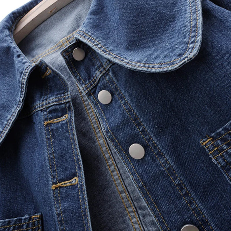 Light blue Valentina Lumina Wear classic fit denim jacket with button closure, shown on a model in a casual outdoor setting.