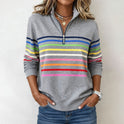 Colorful striped half-zip sweatshirt by Lumina Wear featuring vibrant patterns and a comfortable fit.