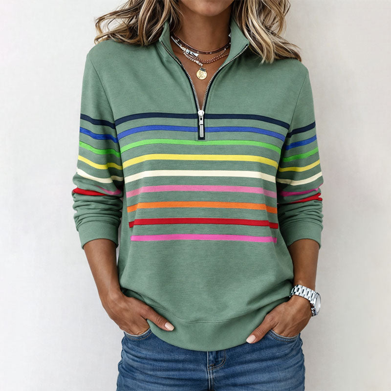 Colorful striped half-zip women's pullover sweatshirt by Lumina Wear with vibrant pattern and cozy fit.